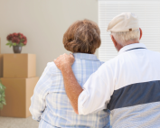 an elderly couple moving into their adult kids home