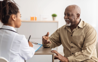 a senior man with a care coordinator