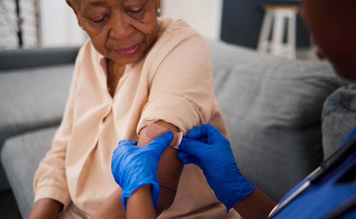 Elderly woman receiving healthcare.